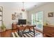 Bright home office with hardwood floors, large window, and stylish decor at 2205 Waters Ferry Dr, Lawrenceville, GA 30043