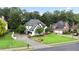 Aerial view of white home with lush lawn and beautiful landscaping on a quiet street at 2714 Twin Leaf Trl, Marietta, GA 30062