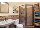 Modern bathroom featuring a glass shower, decorative tile accents, and a pedestal sink at 2714 Twin Leaf Trl, Marietta, GA 30062
