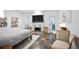 Bedroom with stone fireplace, white decor, and access to an outdoor area at 2714 Twin Leaf Trl, Marietta, GA 30062