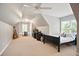 Bright bedroom featuring carpet, a ceiling fan, dormer windows, and a twin bed at 2714 Twin Leaf Trl, Marietta, GA 30062