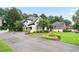 Home exterior with lush lawn, beautiful landscaping, and a long, paved driveway at 2714 Twin Leaf Trl, Marietta, GA 30062