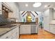 Bright kitchen boasting stainless steel appliances, granite countertops, and access to the dining area at 2714 Twin Leaf Trl, Marietta, GA 30062