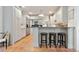 Spacious kitchen featuring white cabinets, granite countertops, and a breakfast bar with seating at 2714 Twin Leaf Trl, Marietta, GA 30062