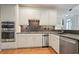 Well-equipped kitchen with granite countertops, stainless steel appliances, and custom cabinetry at 2714 Twin Leaf Trl, Marietta, GA 30062