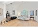 Bright living room boasts vaulted ceilings, hardwood floors, and large windows with plantation shutters at 2714 Twin Leaf Trl, Marietta, GA 30062