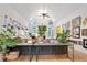 Bright living room boasting vaulted ceilings, artistic decor, and a unique console table with integrated greenery at 2714 Twin Leaf Trl, Marietta, GA 30062