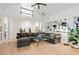 Open living room featuring a comfortable sectional sofa, hardwood floors, and elegant white columns at 2714 Twin Leaf Trl, Marietta, GA 30062