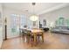 Open-concept living and dining area boasts hardwood floors and large windows for natural light at 2714 Twin Leaf Trl, Marietta, GA 30062