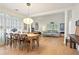 Open-concept living space combines dining and living areas with hardwood floors and large windows at 2714 Twin Leaf Trl, Marietta, GA 30062