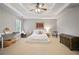 Spacious main bedroom with tray ceiling, neutral palette and ample natural light at 2714 Twin Leaf Trl, Marietta, GA 30062