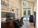 Bright home office featuring built-in shelving, backyard views, and space for productivity at 2714 Twin Leaf Trl, Marietta, GA 30062