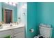 Well-lit bathroom featuring a vanity and toilet at 3500 Stillwood Dr, Snellville, GA 30039