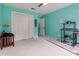 Bright bedroom with a large closet, light carpet, and a light blue accent wall at 3500 Stillwood Dr, Snellville, GA 30039