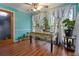 Bright dining area featuring wood floors, large windows, and charming curtains at 3500 Stillwood Dr, Snellville, GA 30039