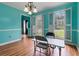 Traditional dining room with wood floors and classic shutters on the windows at 3500 Stillwood Dr, Snellville, GA 30039