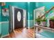 Bright foyer with hardwood floors, complemented by a staircase and views into adjacent rooms at 3500 Stillwood Dr, Snellville, GA 30039