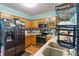 Well-equipped kitchen with wooden cabinets, stainless steel appliances, and a double-basin sink at 3500 Stillwood Dr, Snellville, GA 30039