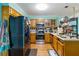 Functional kitchen featuring stainless steel appliances, wooden cabinetry and a tile backsplash at 3500 Stillwood Dr, Snellville, GA 30039