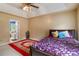 Comfortable main bedroom features a large bed, tray ceiling, and plush carpeting at 3500 Stillwood Dr, Snellville, GA 30039