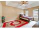 Inviting main bedroom with tray ceilings, cozy rug, and natural light at 3500 Stillwood Dr, Snellville, GA 30039