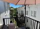 White brick building with patios and balconies and an umbrella at 1078 Piedmont Ne Ave # 206, Atlanta, GA 30309