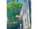Apartment balcony with patio umbrella and large green tree at 1078 Piedmont Ne Ave # 206, Atlanta, GA 30309