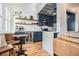 Modern kitchen with custom blue cabinets, stainless steel appliances, and a waterfall island at 1078 Piedmont Ne Ave # 206, Atlanta, GA 30309