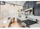 Bright, modern kitchen features stainless steel appliances and eat-in table near a large window at 1078 Piedmont Ne Ave # 206, Atlanta, GA 30309