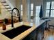 Kitchen island with a black sink and stainless steel dishwasher at 1078 Piedmont Ne Ave # 206, Atlanta, GA 30309
