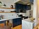 Modern kitchen with stainless steel appliances, white countertops, and dark blue cabinets at 1078 Piedmont Ne Ave # 206, Atlanta, GA 30309