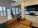 Open concept living room and kitchen area with hardwood floors, natural light, and comfortable seating at 1078 Piedmont Ne Ave # 206, Atlanta, GA 30309