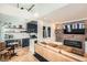 Bright living room next to a well-equipped kitchen with brick accent wall and fireplace at 1078 Piedmont Ne Ave # 206, Atlanta, GA 30309