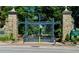 Grand entrance to Piedmont Park with ornate stone pillars and iron gate at 1078 Piedmont Ne Ave # 206, Atlanta, GA 30309