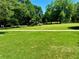 Lush green lawn, walking path, and mature trees in Atlanta's Piedmont Park at 1078 Piedmont Ne Ave # 206, Atlanta, GA 30309