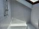 Modern gray tiled shower with skylight and built-in bench at 1078 Piedmont Ne Ave # 206, Atlanta, GA 30309