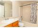 Bathroom featuring a single sink vanity and a shower-tub combination at 1382 Koble Mill Ln, Riverdale, GA 30296