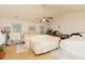 Spacious bedroom with ample natural light, ceiling fan, and neutral color scheme at 1382 Koble Mill Ln, Riverdale, GA 30296