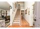 Inviting foyer with staircase, tile flooring, and wood accents at 1382 Koble Mill Ln, Riverdale, GA 30296