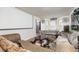 Comfortable living room featuring hardwood floors, sofas, and large media screen at 1382 Koble Mill Ln, Riverdale, GA 30296