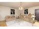Spacious living room with elegant sofas, glass tables, and neutral tones, perfect for relaxation and gatherings at 1382 Koble Mill Ln, Riverdale, GA 30296