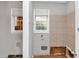 This bathroom is under construction with missing drywall, an installed tiled shower, and a window at 5267 Sheppard Ln, Stone Mountain, GA 30083