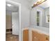 Bathroom featuring a light fixture and a large mirror, ready for renovation and customization at 5267 Sheppard Ln, Stone Mountain, GA 30083