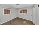 Bedroom with laminate flooring, window with blinds, and white trim at 5267 Sheppard Ln, Stone Mountain, GA 30083