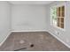 Cozy carpeted bedroom featuring natural light from the window at 5267 Sheppard Ln, Stone Mountain, GA 30083