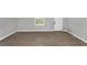 Bright living room features neutral walls, new flooring, and a window providing natural light at 5267 Sheppard Ln, Stone Mountain, GA 30083