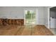Bright living room features neutral walls and a sliding glass door to the outside deck at 5267 Sheppard Ln, Stone Mountain, GA 30083