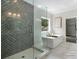 Luxurious bathroom with soaking tub, glass shower, and stylish tile at 912 Sunny Meadows Ln, Marietta, GA 30062