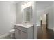 Bathroom features neutral finishes, with a door leading to the hallway at 912 Sunny Meadows Ln, Marietta, GA 30062