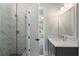 Modern bathroom features glass shower, gray vanity with white counter, and neutral tile at 912 Sunny Meadows Ln, Marietta, GA 30062